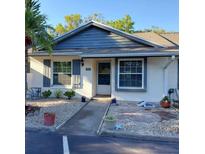 Charming single-story home featuring a well-manicured front yard and inviting entrance at 3911 La Costa Ln, Largo, FL 33771