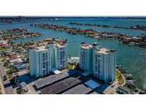 Aerial view of the condo complex, highlighting the waterfront location and surrounding community at 420 64Th Ave # 907, St Pete Beach, FL 33706