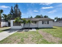 Charming single-story home with a well-maintained lawn and fresh, neutral exterior paint at 564 Florida S Cir, Apollo Beach, FL 33572