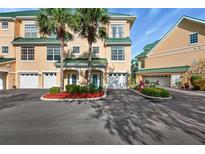 Charming condo with a green roof, complemented by lush landscaping and a private garage at 6327 Sunset Bay Cir, Apollo Beach, FL 33572