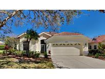 Charming single-story home with a two-car garage and well-maintained landscaping at 6805 Winslow St, Sarasota, FL 34243