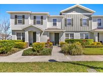Charming townhome with neat landscaping and inviting front entrances at 14925 Promenade Pkwy, Odessa, FL 33556