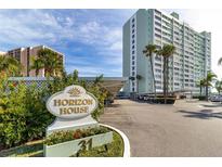 Beautiful high rise with lovely sign, landscaping and convenient covered parking area at 31 Island Way # 106, Clearwater Beach, FL 33767