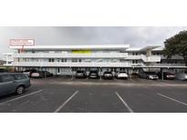 Exterior view of building showing parking and stairway access to units at 4895 Bay Ne St # 311, St Petersburg, FL 33703