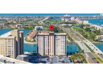Stunning aerial view of the building showcasing its prime location near the water and city at 5220 Brittany S Dr # 309, St Petersburg, FL 33715