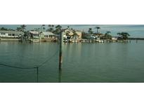 Beautiful waterfront homes with docks and boat lifts offer stunning views and direct access to the water at 780 116Th Ave, Treasure Island, FL 33706