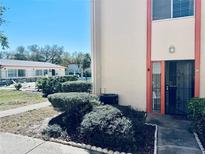 Charming condo with a well-maintained front entrance and view of the community pool at 1620 58Th Ave. S. # 1, St Petersburg, FL 33712