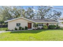 Charming single-story home with a lush green lawn and mature trees in a desirable neighborhood at 217 2Nd Sw St, Largo, FL 33770
