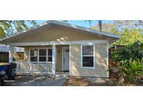 Inviting exterior of charming home, featuring a cozy front porch and well-maintained siding at 522 Mclennan St, Clearwater, FL 33756