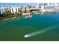 Aerial view of waterfront property with private boat docks and access to the Gulf at 19937 Gulf Blvd # B-3, Indian Shores, FL 33785