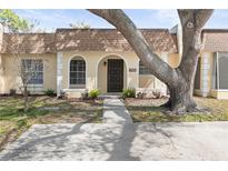 Charming home featuring a well-maintained lawn and inviting facade in a quiet neighborhood at 9845 84Th Way, Seminole, FL 33777