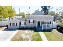 Charming single-story home with a welcoming front porch and well-maintained landscaping at 210 83Rd N Ave, St Petersburg, FL 33702