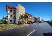 Low-rise condominium with parking and exterior walls with unique architectural details at 3010 59Th S St # 314, Gulfport, FL 33707