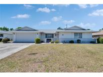 Charming single-story home featuring a manicured front yard and an attached garage, offering both curb appeal and convenience at 1508 W Del Webb Blvd, Sun City Center, FL 33573