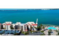 Stunning condo complex featuring red roofs, a refreshing pool, and beautiful ocean views at 5729 Puerta Del Sol Boulevard South # 486, St Petersburg, FL 33715