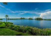 Scenic water view showcasing lush greenery and serene blue waters under a clear sky at 5915 Sea Ranch Dr # 403, Hudson, FL 34667
