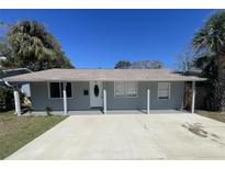 Charming single-story home with a concrete driveway and a freshly painted exterior with manicured landscaping at 645 38Th S Ave, St Petersburg, FL 33705