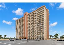 Modern high-rise condo building featuring private balconies, neutral colors and ample parking at 4900 Brittany S Dr # 205, St Petersburg, FL 33715