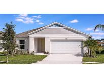 Charming single-story home featuring a two-car garage, well-manicured lawn, and appealing architectural details at 14777 Summer Branch Dr, Lithia, FL 33547