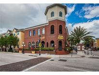 Charming brick building featuring a unique architectural design and street-level commercial spaces at 1810 E Palm Ave # 5222, Tampa, FL 33605