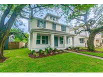 Charming two-story home with landscaped yard and welcoming front porch at 324 37Th Ne Ave, St Petersburg, FL 33704