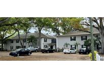 Two-story apartment building with mature trees and plenty of parking at 5221 Bayshore Blvd # 29, Tampa, FL 33611