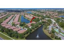 Gorgeous aerial view of a lakeside community with lush landscaping and meticulously maintained lawns at 178 Shell Falls Dr, Apollo Beach, FL 33572