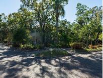 Charming home nestled among lush trees with a brick street and sidewalk for neighborhood walks at 1030 2Nd N St, St Petersburg, FL 33701