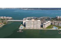 Beautiful aerial view of waterfront condominium complex with lush landscaping and ocean views at 5200 Brittany S Dr # 1503, St Petersburg, FL 33715
