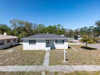 Charming single-story home featuring a well-maintained front yard and sidewalk leading to the front door at 801 37Th S Ave, St Petersburg, FL 33705