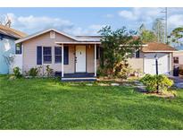 Charming single-story home featuring a well-maintained lawn and inviting front porch at 2811 60Th N Ave, St Petersburg, FL 33714