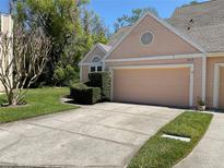 Charming home featuring a well-maintained lawn, a two-car garage and manicured landscaping at 3610 Lost Pine Way # 3610, Valrico, FL 33596