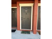 Condo front door with visible unit number and welcome mat, offering a secure entry at 5553 Baywater Dr, Tampa, FL 33615