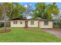 Charming single-story home with a well-maintained lawn and brick pathway leading to the front door at 3684 14Th Se Ave, Largo, FL 33771