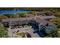 An aerial view of a beautiful waterfront community with ample parking and mature landscaping at 2019 Utopian W Dr # 310, Clearwater, FL 33763