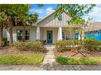 Charming single-story home with a inviting front porch and well-maintained landscaping at 4127 Broad Porch Run, Land O Lakes, FL 34638