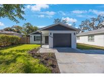Charming single-story home with a well-manicured lawn and a freshly painted exterior at 509 13Th Nw Ave, Largo, FL 33770