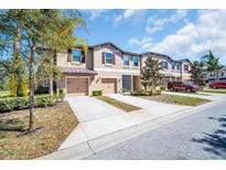 Inviting townhomes featuring attached garages and manicured landscaping at 8512 Reedville St, New Port Richey, FL 34654