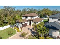 Gorgeous aerial view of the home showcasing the manicured lawn and surrounding landscaping at 11215 53Rd N Ave, St Petersburg, FL 33708