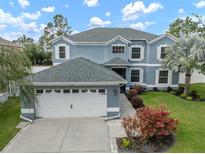 Beautiful two-story home with a large garage, fresh paint, and well-manicured lawn at 11310 Callaway Pond Dr, Riverview, FL 33579