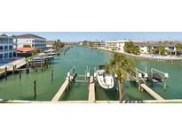 Expansive waterfront view featuring a private boat dock and lift for convenient access to open waters at 156 117Th Ave, Treasure Island, FL 33706