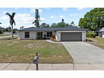 Charming home with a well-manicured lawn, freshly painted exterior, and a two-car garage at 2008 41St W St, Bradenton, FL 34205