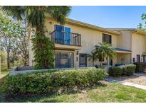 Charming townhouse featuring a private balcony and well-maintained landscaping at 9037 Pebble Creek Dr, Tampa, FL 33647