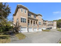 Beautiful townhouse featuring a private garage and lovely architectural details at 94 S Highland Ave # 2402, Tarpon Springs, FL 34689