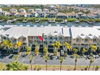 Waterfront condos featuring multi-level balconies and covered parking and canal access for boating and scenic views at 545 Bahia Beach Blvd, Ruskin, FL 33570