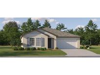 Charming single-story home featuring a two-car garage, well-manicured lawn, and classic architectural details at 10301 Gentle Rain Dr, Land O Lakes, FL 34638