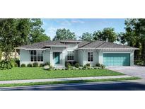 Charming single-story home boasts a light blue exterior, well-manicured lawn, and an attached two-car garage at 24276 Peppercorn Rd, Punta Gorda, FL 33955