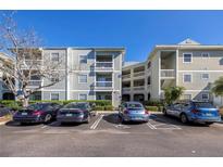 Attractive condominium building with reserved covered parking and balconies for residents and guests at 6826 Stones Throw N Cir # 11104, St Petersburg, FL 33710