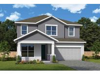 Charming two-story home with gray siding, white trim, and a covered front porch, showcasing classic suburban appeal at 10649 Crescent Creek Xing, Parrish, FL 34219