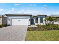 Charming single-story home with a well-manicured lawn and a two-car garage at 4597 Blue Star Ct, North Port, FL 34289